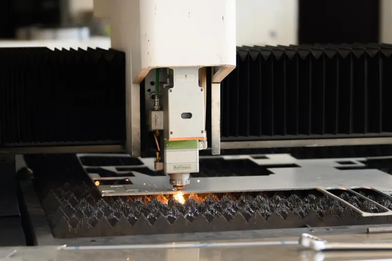 Laser cutting a metal sheet at the STOK Engineering factory